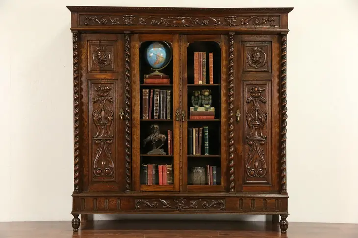 Oak 1890's Bookcase, Hand Carved Knights, Beveled Glass, Spiral Columns