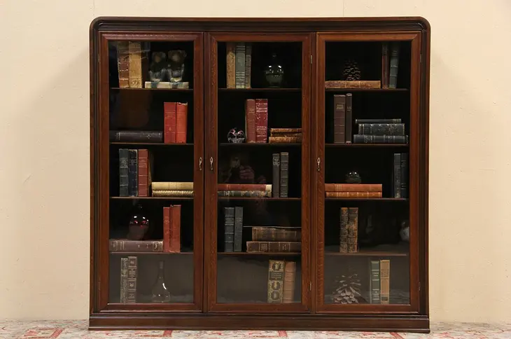 Triple Oak 1915 Antique Bookcase, Wavy Glass Doors & Adjustable Shelves