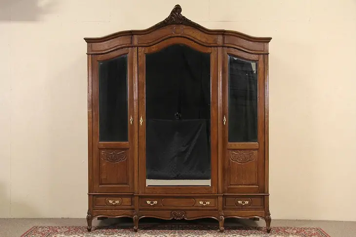 Country French Carved Oak 1900 Antique Triple Armoire, Beveled Mirror Doors