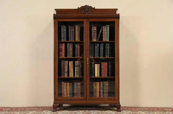 Oak 1900 Antique Bookcase, Carved Gargoyle Face, Wavy Glass Doors