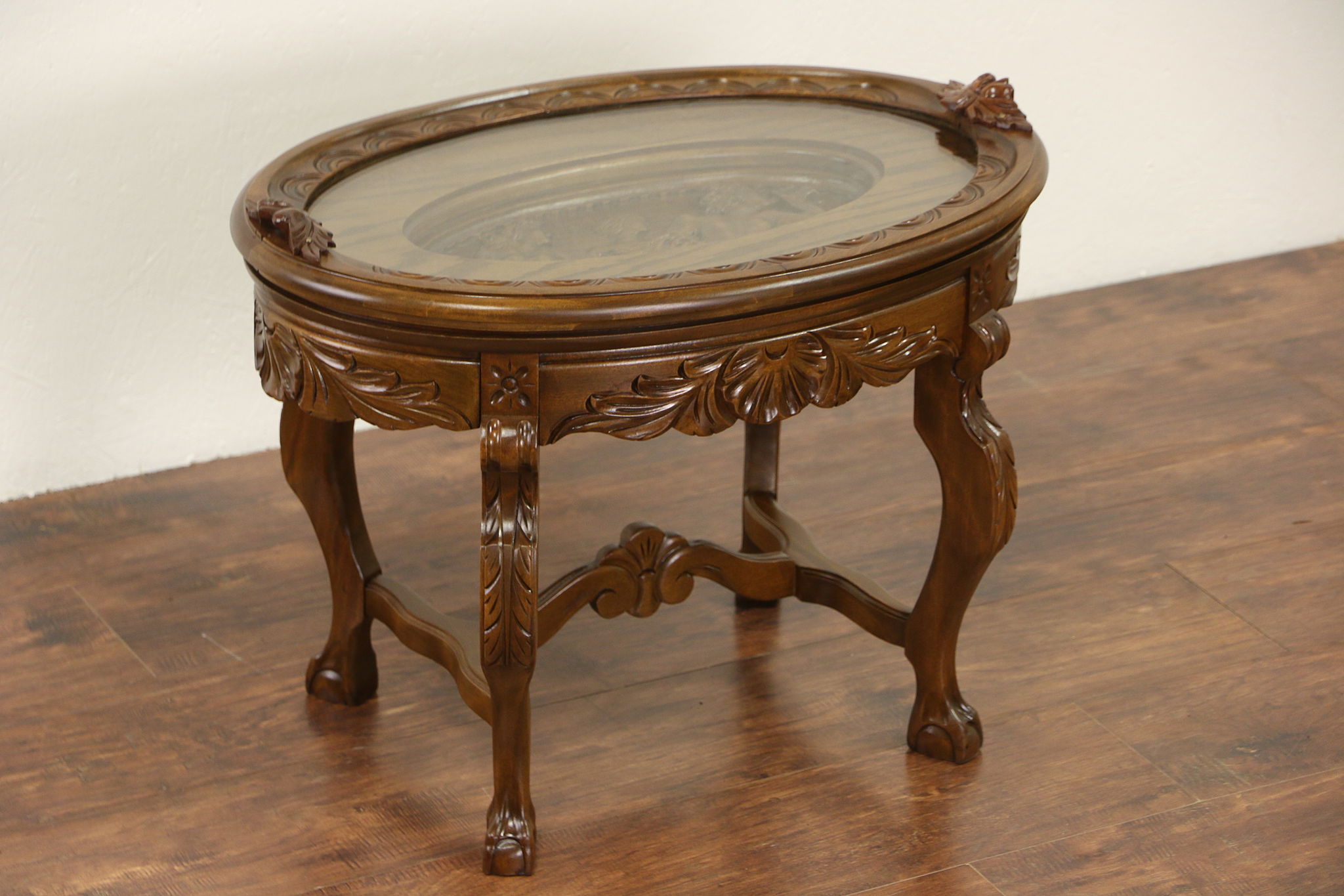 Hand carved coffee table shop with glass top