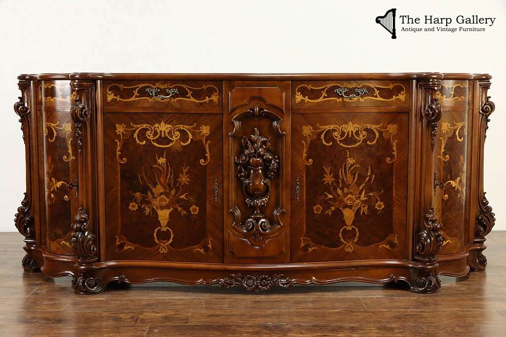 ornately decorated veneered antique sideboard