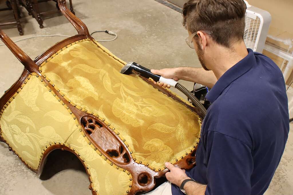 artisan restoring chair