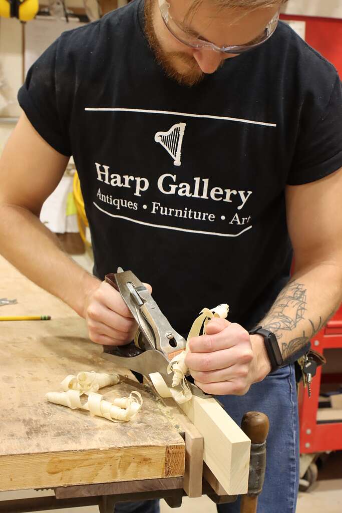 artisan planing wood