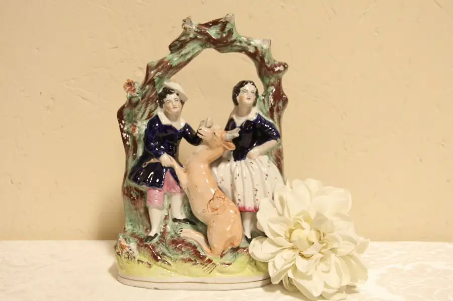 Main image of Antique Staffordshire Pottery Couple with a Deer