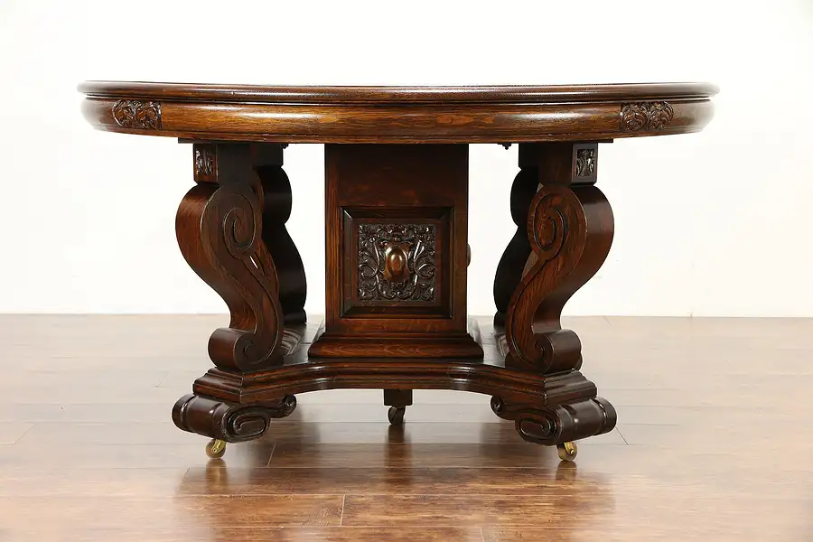 Main image of Oak Carved Antique 54" Round Dining Table, 5 Leaves, Extends 9'