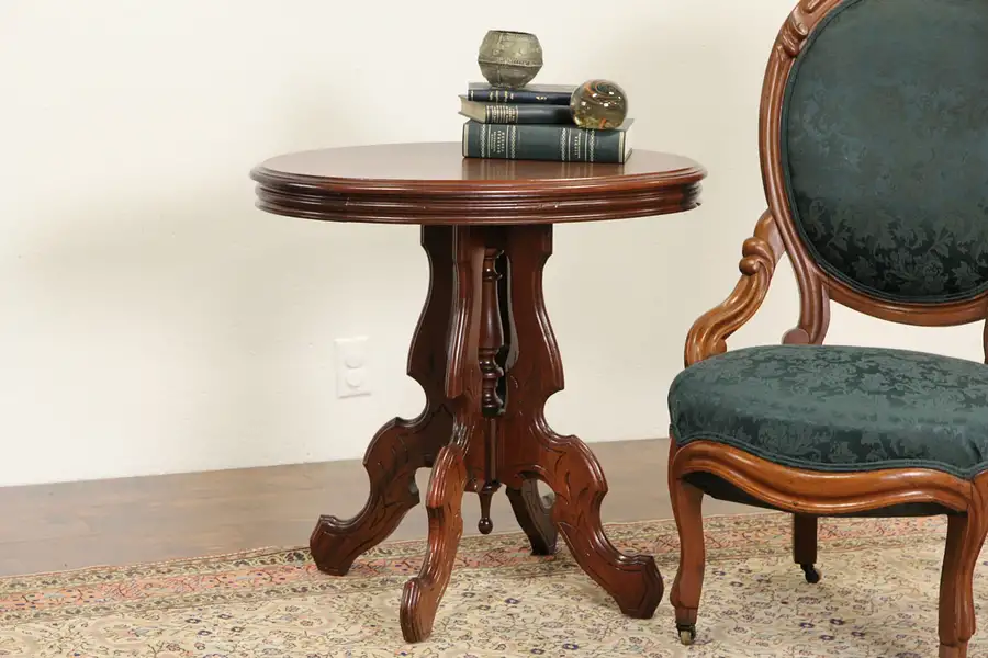 Main image of Victorian Oval 1880 Antique Carved Walnut Parlor Lamp Table