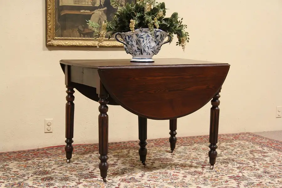 Main image of Oval 1885 Antique Oshkosh Oak Dining Table, Extends 10'