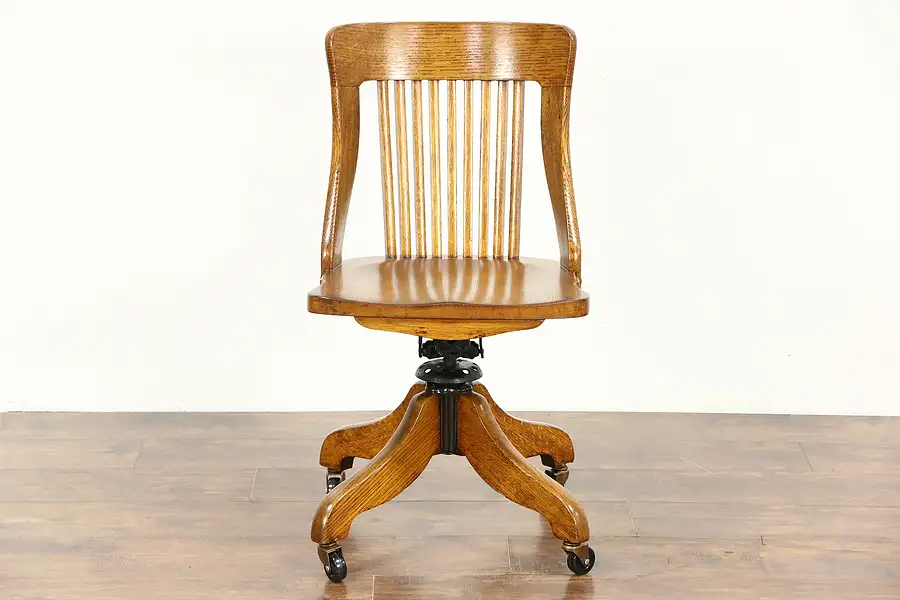 Main image of Oak 1910 Antique Swivel Adjustable Desk Chair, Signed Sheboygan, WI