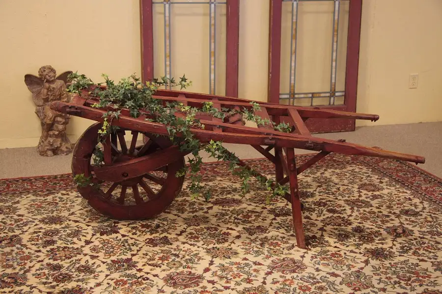 Main image of Hand Carved Antique Garden Wheelbarrow