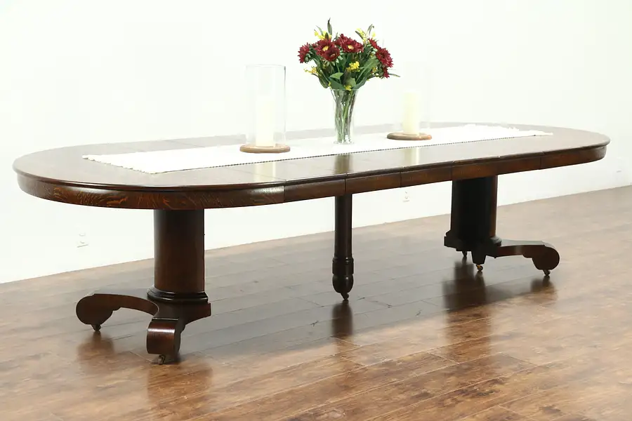 Main image of Empire Round 54" Antique 1900 Oak Dining Table, 6 Leaves, Extends 10' 6"