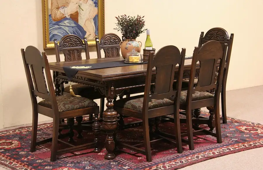 Main image of Tudor Carved Oak 1925 Dining Set, Table, 2 Leaves & 6 Chairs