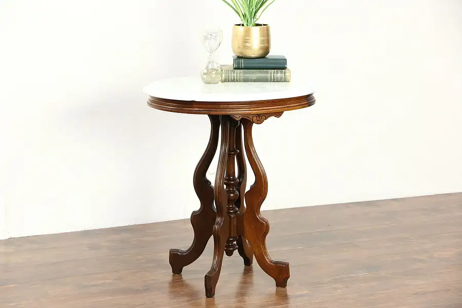 Main image of Victorian Oval Marble Top 1880's Antique Carved Walnut Parlor or Lamp Table