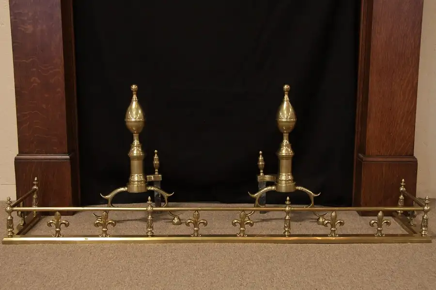 Main image of Fleur de Lis Antique Brass Fireplace Fender