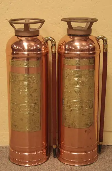 Main image of Pair Red Star Copper & Brass Fire Extinguishers
