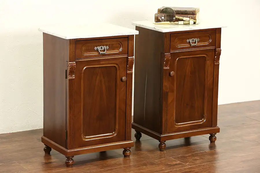 Main image of Pair of 1890's Antique Austrian Marble Top Carved Walnut Nightstands