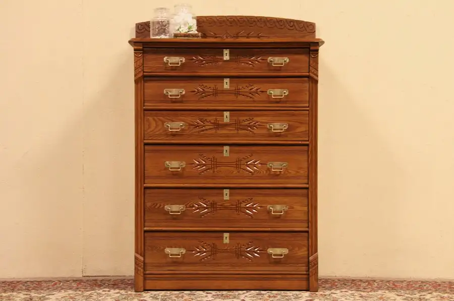 Main image of Victorian Eastlake 1885 Antique Oak Spoon Carved Tall Chest or Dresser