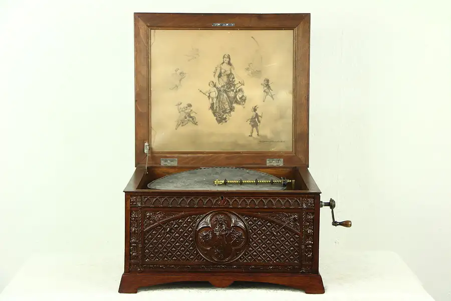 Main image of Regina Signed Antique Music Box, Angel Carved Mahogany Case, 6 Discs 15"