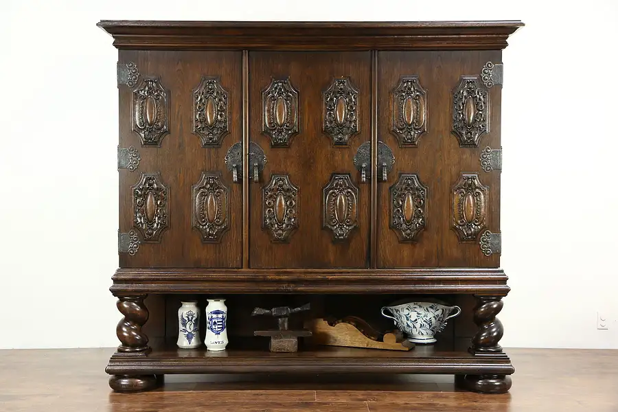 Main image of Oak 1910 Antique Cabinet, Carved Armorial Crests, Spiral Columns