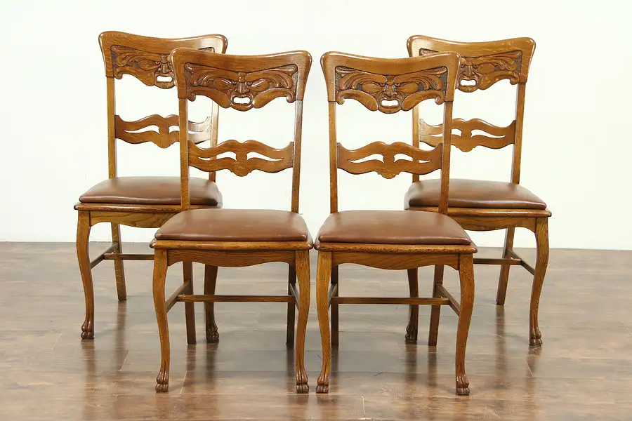 Main image of Set of 4 Antique North Wind Carved Oak Dining or Game Chairs, Leather Seats