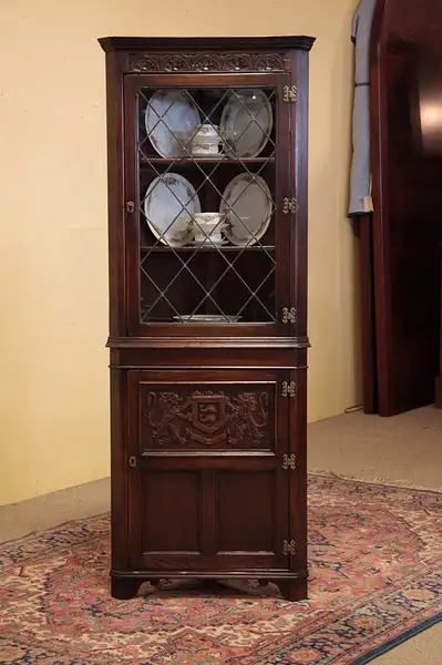 Main image of Oak Carved Corner Cabinet Leaded Glass & Crest 1925