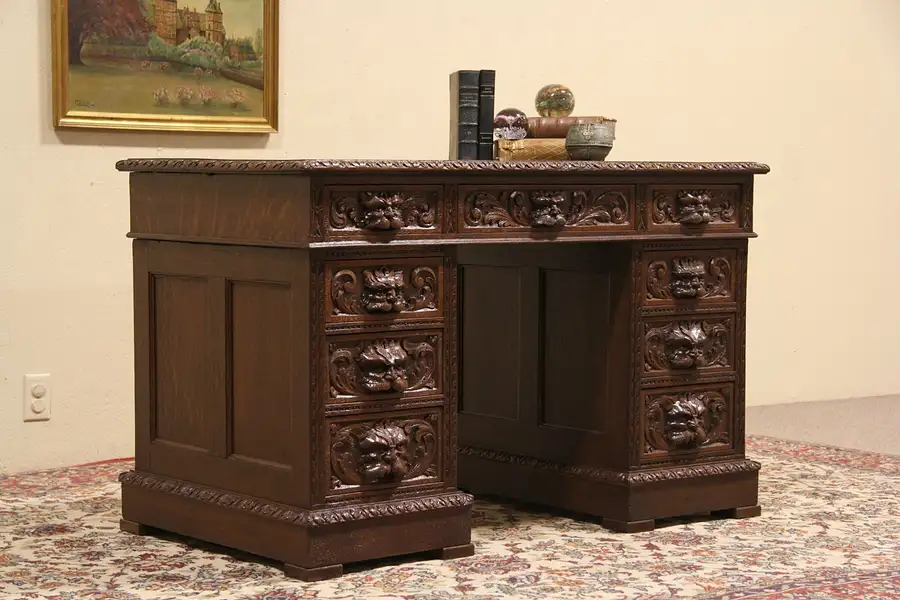 Main image of Carved Oak 1900 English Lion Head Desk, Leather Top