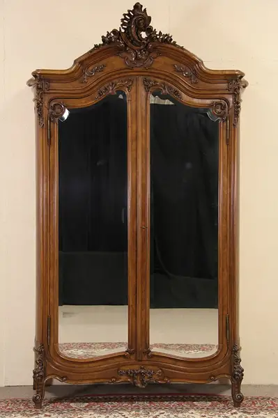 Main image of French 1900 Antique Carved Walnut Armoire, Shaped Beveled Mirror Doors