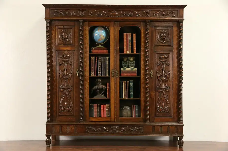 Main image of Oak 1890's Bookcase, Hand Carved Knights, Beveled Glass, Spiral Columns