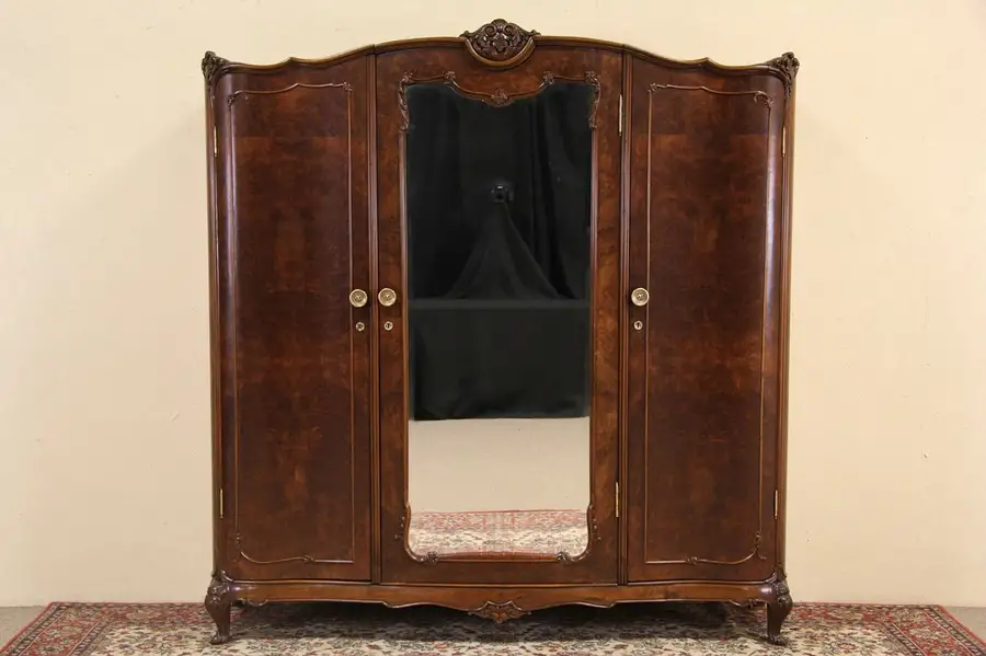 Main image of Italian Antique 1920 Carved Triple Armoire or Wardrobe, Beveled Mirror