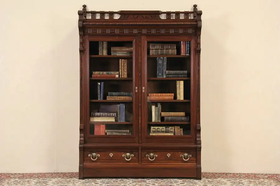 Main image of Victorian Eastlake Walnut & Burl Carved 1870's Antique Bookcase, Lion Pulls