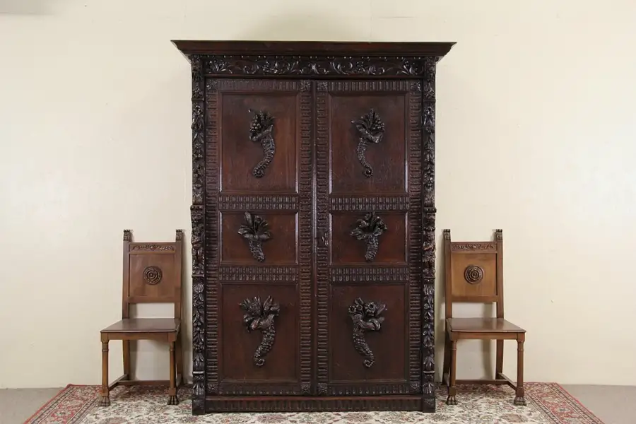 Main image of Renaissance Oak Antique 1870 French Armoire Cabinet, Carved Angels, Lions & Frui