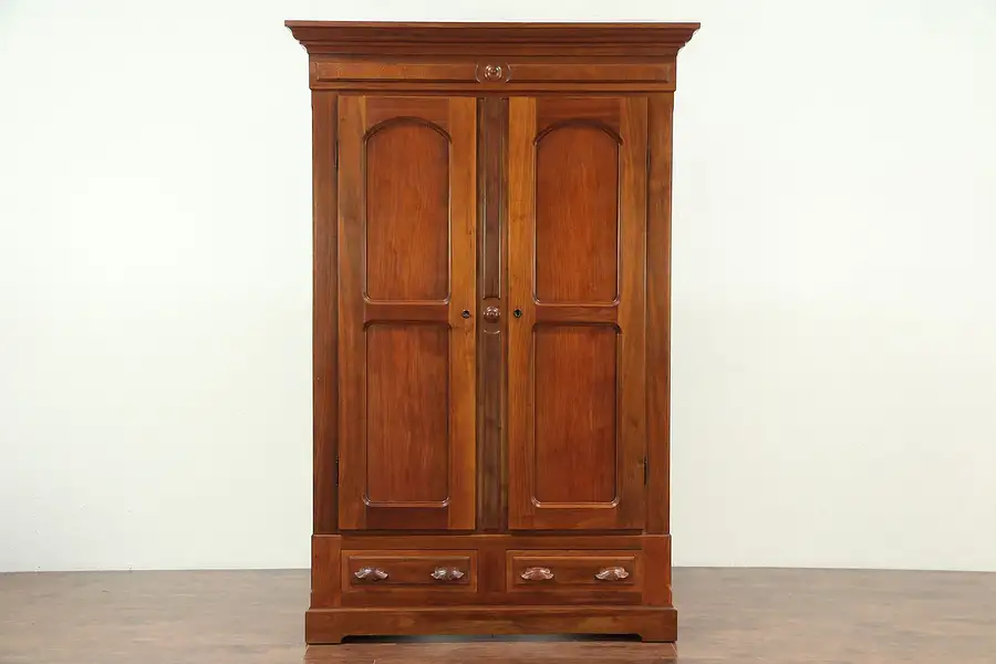 Main image of Victorian Antique 1875 Walnut Armoire, Wardrobe or Closet, Carved Pulls
