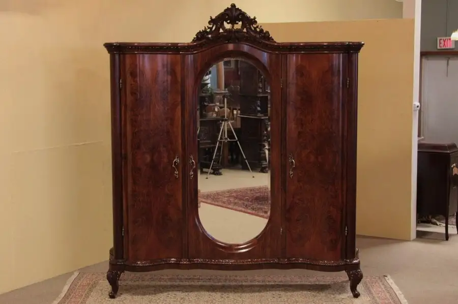 Main image of Carved Walnut Triple Armoire, Oval Beveled Mirror