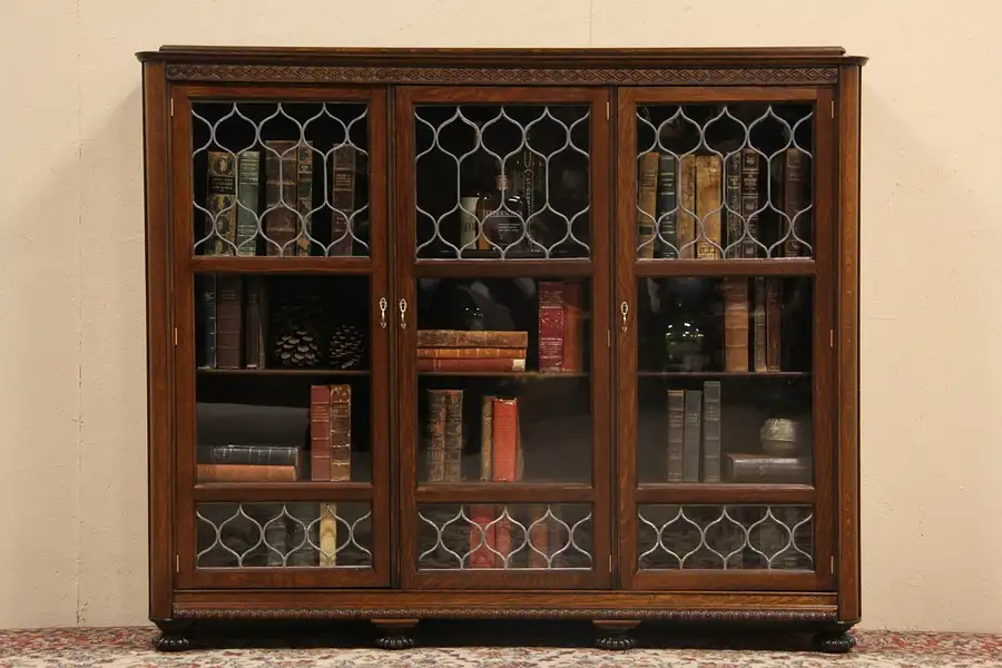 Main image of Triple Carved Oak 1895 Antique Bookcase, Leaded Glass Doors