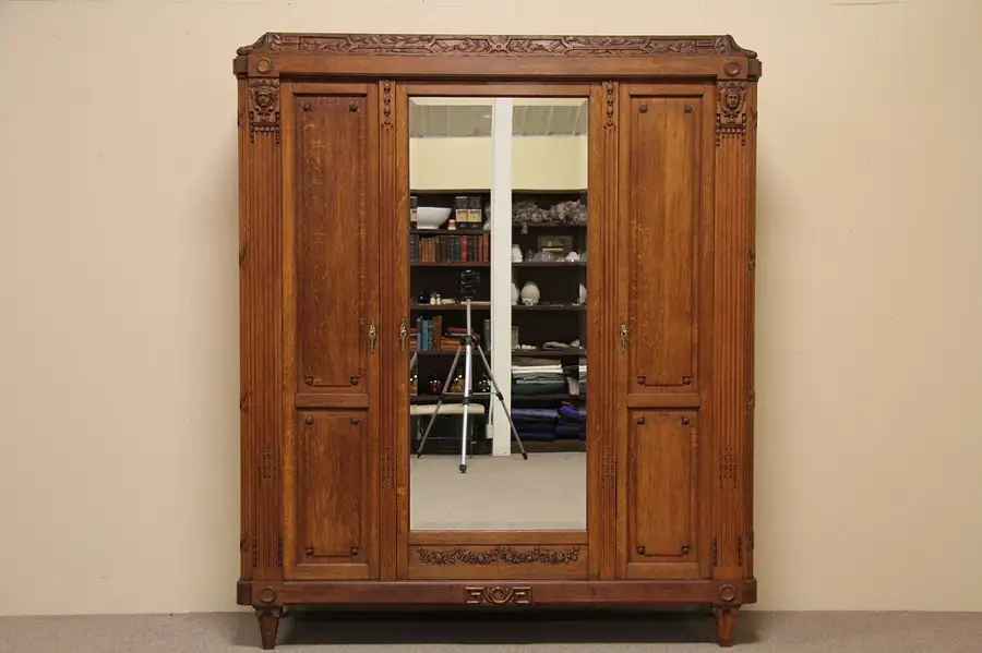 Main image of Carved French Oak Triple Armoire