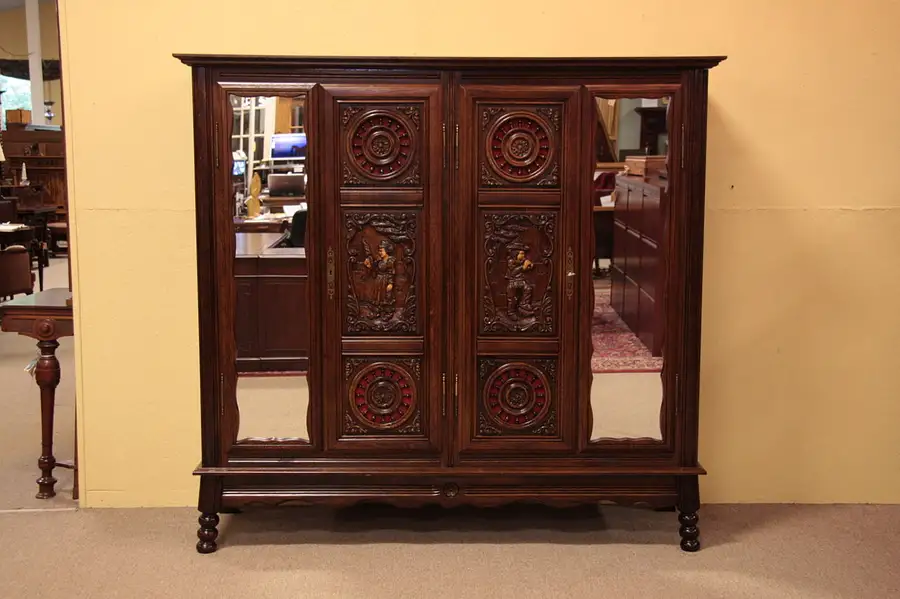 Main image of Brittany French 4 Door Armoire, Carved Folk Figures