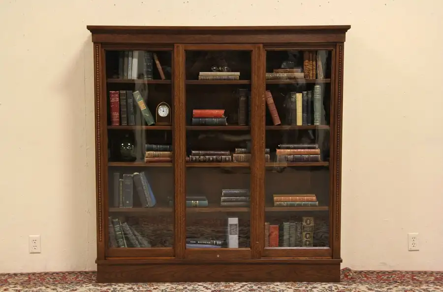 Main image of Oak 1900 Antique Bookcase, 3 Sliding Wavy Glass Doors