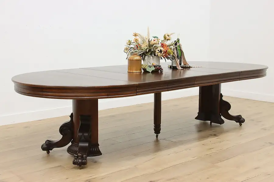 Main image of Victorian Antique 54" Oak Dining Table, 5 Leaves, Paw Feet