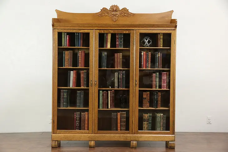 Oak Triple Antique Bookcase, Carved Northwind Face, Wavy Glass Doors