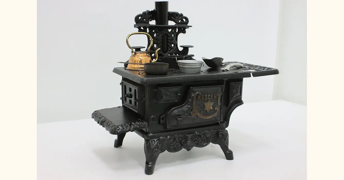 Sold at Auction: Crescent Miniature cast iron Fuel Stove with Pots