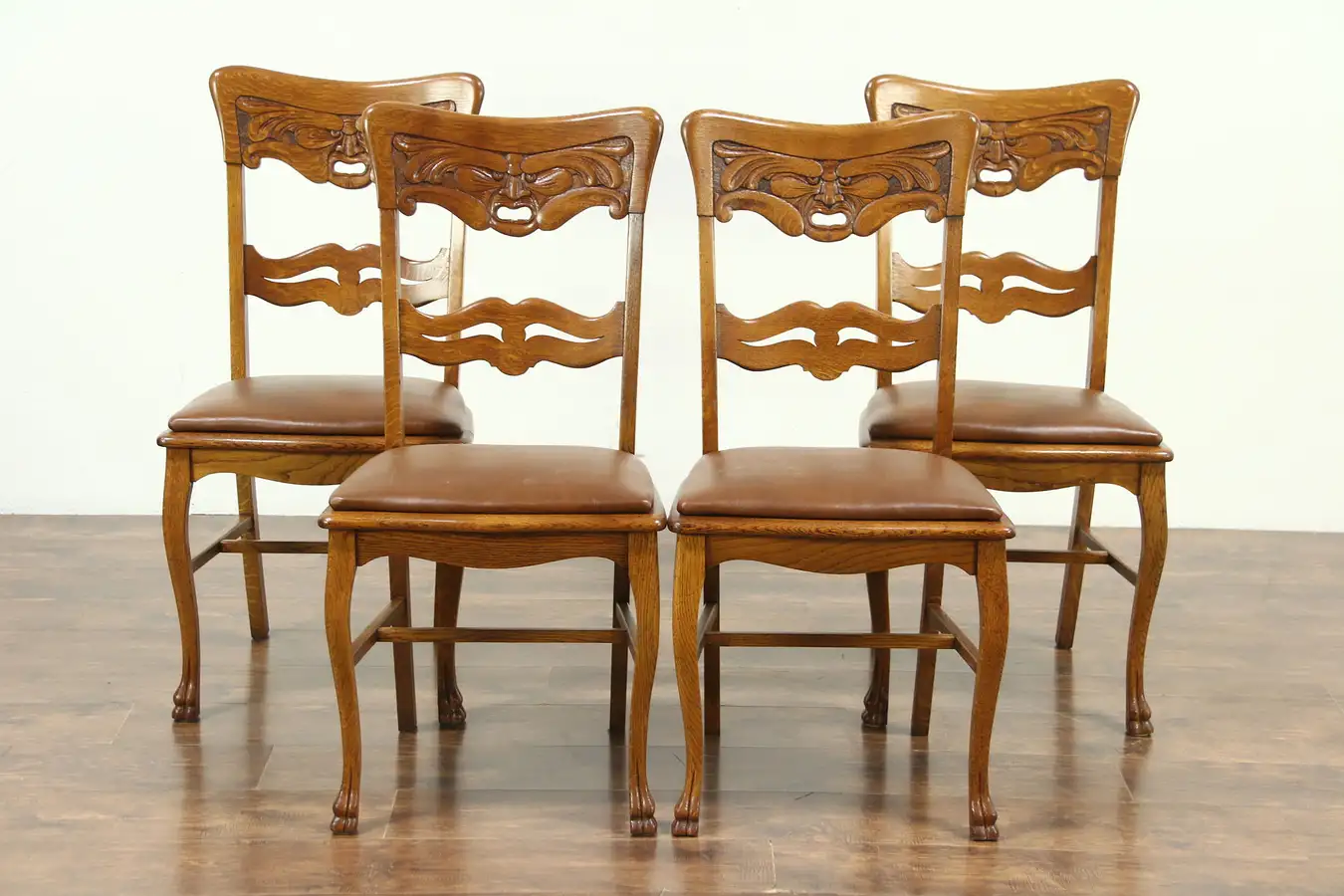 Main image of Set of 4 Antique North Wind Carved Oak Dining or Game Chairs, Leather Seats