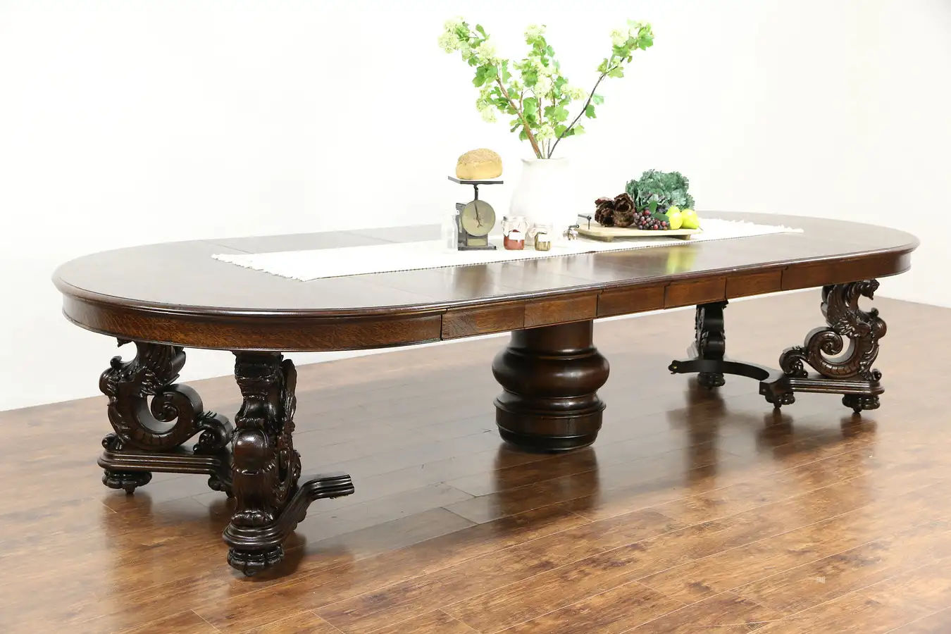 Main image of Oak Griffin Carved 1900 Antique Dining Table, 7 Leaves, Extends 12' Berkey & Gay