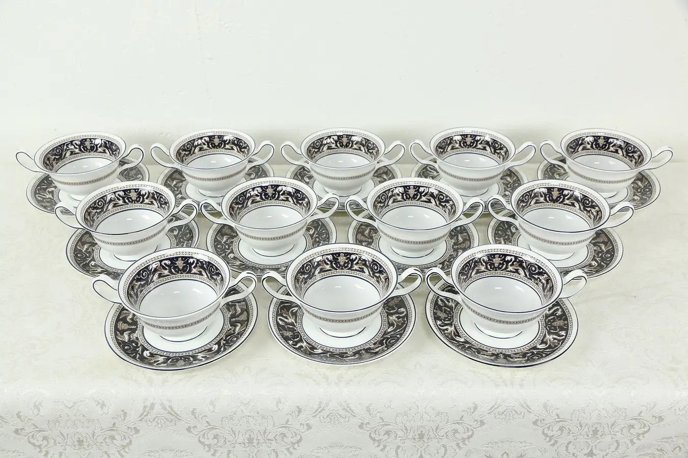 Main image of Wedgwood Cobalt Blue Florentine Pattern Set of 12 Cream Soup Cups Saucers