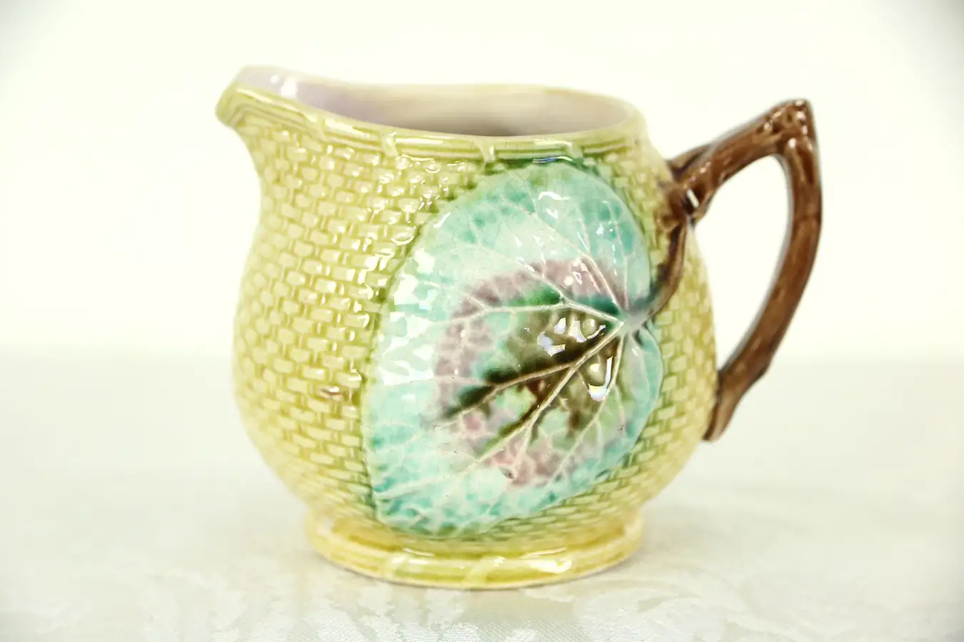 Main image of Majolica Hand Painted Cream Pitcher, 3 3/4" Tall, Leaves and Basketweave