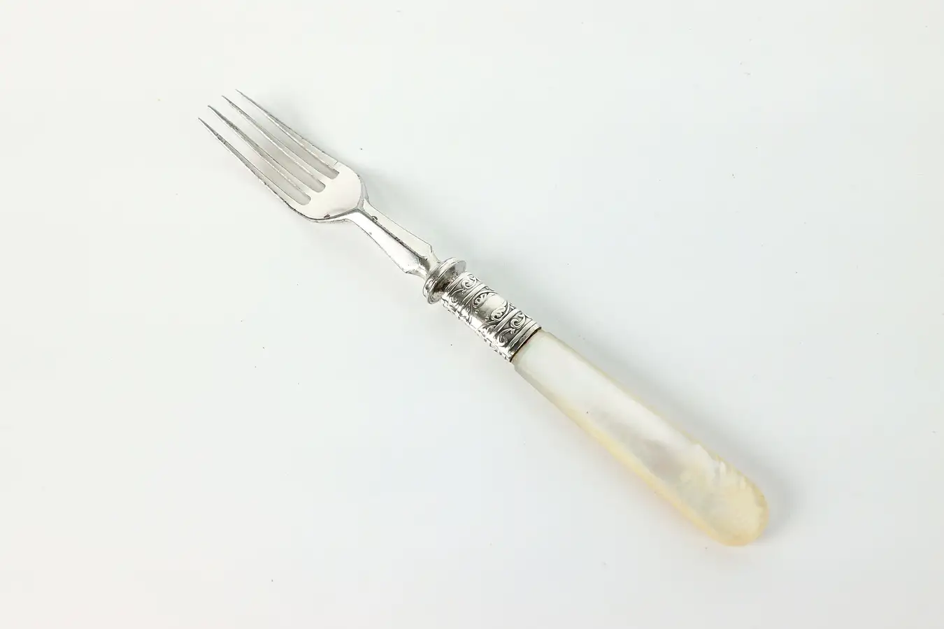Main image of Victorian Antique Silverplate Appetizer or Serving Fork Pearl Handle