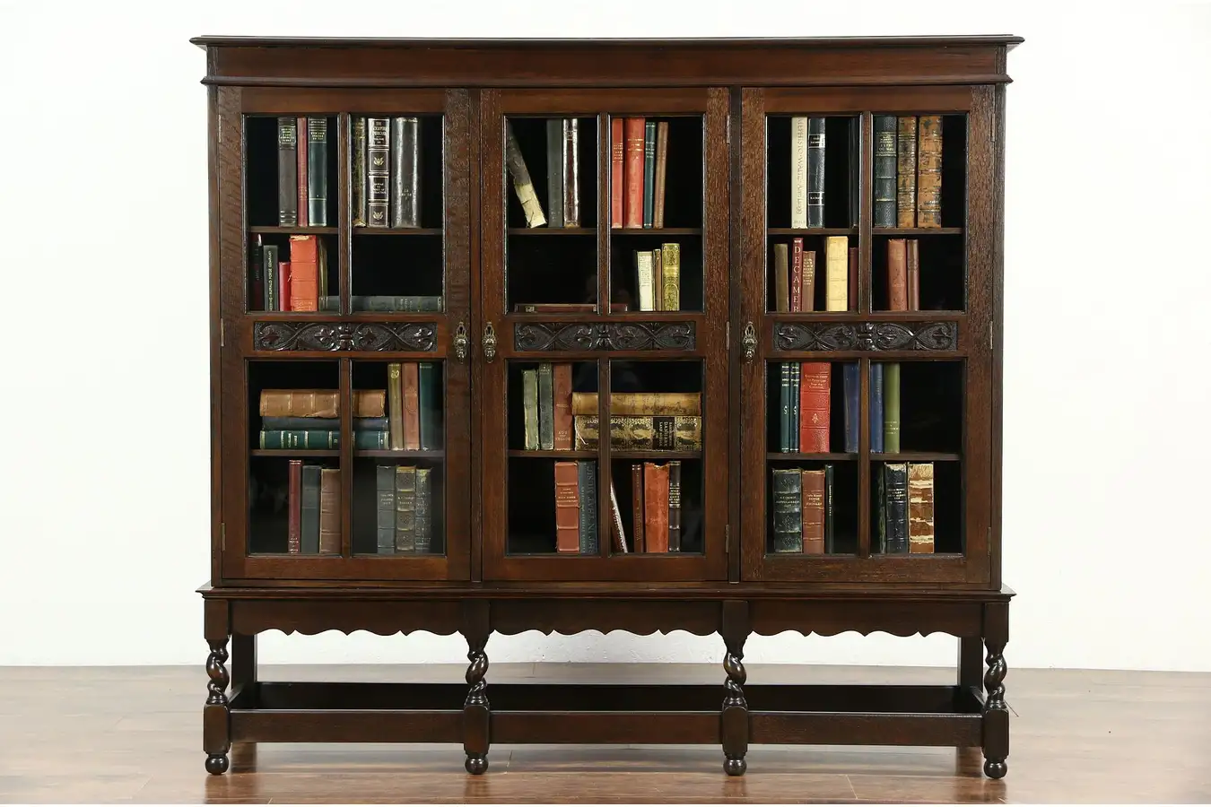 Main image of English Tudor 1915 Antique Carved Oak Triple Library Bookcase, Spiral Legs