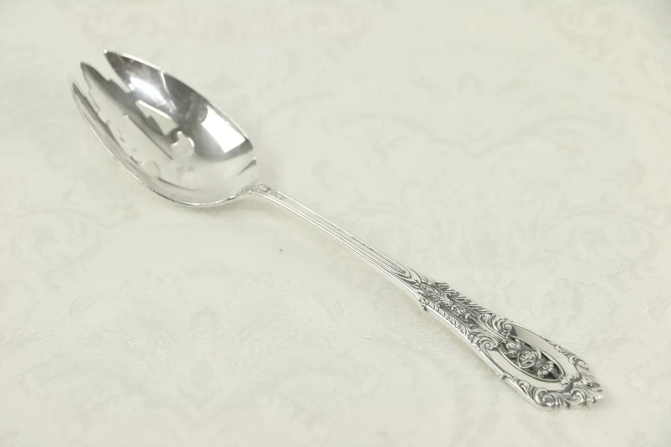 Main image of Sterling Silver Slotted 8 1/2" Serving Spoon, Rose Point by Wallace