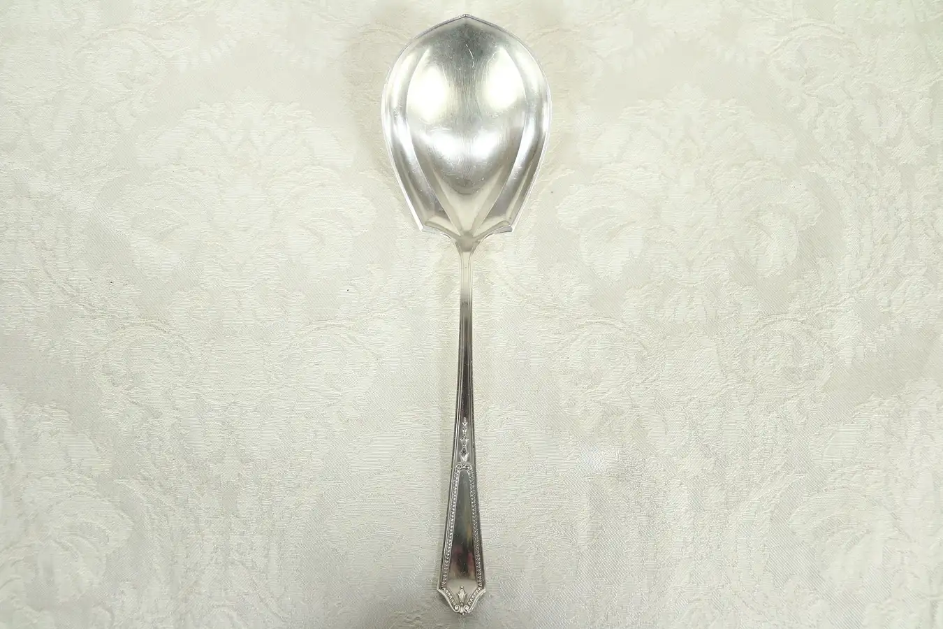 Main image of Sterling Silver Shell Shape Antique Serving Spoon, signed JS & Co, Pat