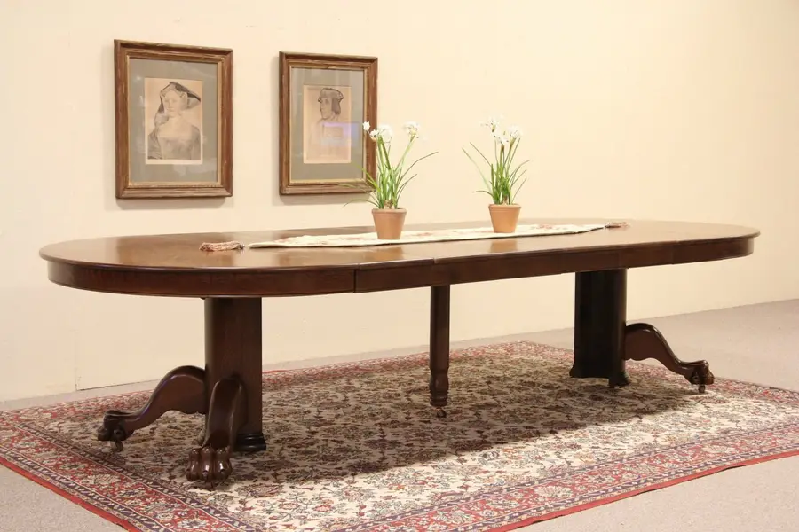 Photo of Round 53" Oak Lion Paw Dining Table, Extends 10' 5".
