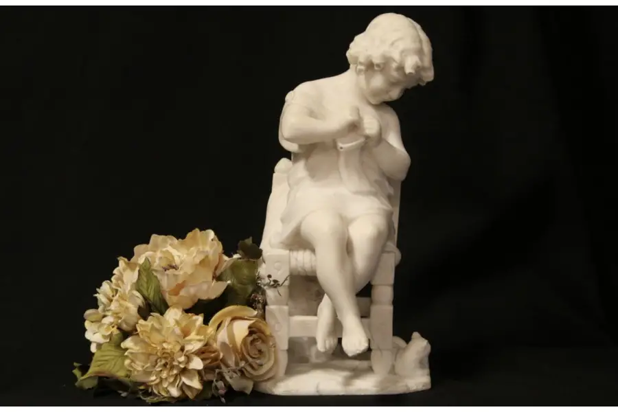 Photo of Marble Antique Sculpture of a Young Girl and Kitten